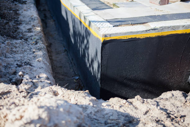 Professional Basement Waterproofing technician working in Flint, MI